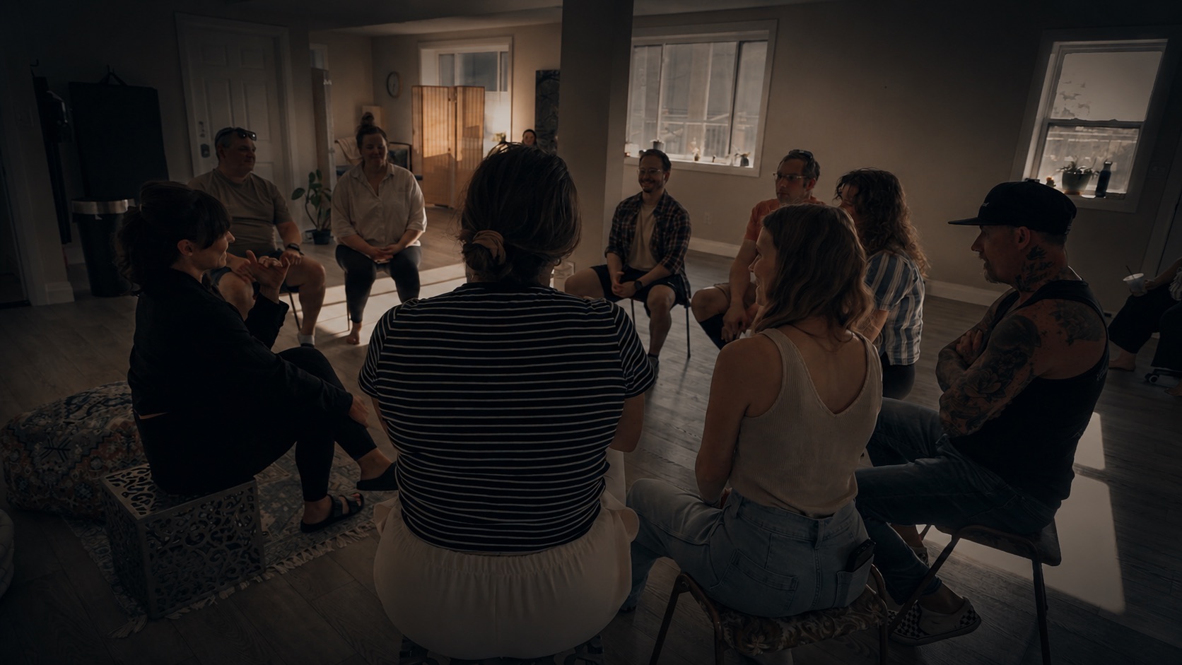 A group therapy session in progress, seated in a circle at eFIT